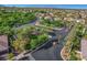 Gated community entrance featuring lush landscaping and well-maintained streets in a suburban setting at 3618 Auckland Castle St, Las Vegas, NV 89135