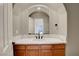 Charming bathroom featuring a modern vanity with a white countertop and a decorative mirror at 3618 Auckland Castle St, Las Vegas, NV 89135
