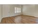 Comfortable bedroom featuring wood flooring, shutters, and ample natural light at 3618 Auckland Castle St, Las Vegas, NV 89135