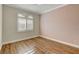 Bedroom with wood floor, shuttered window and base molding at 3618 Auckland Castle St, Las Vegas, NV 89135