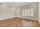 Well-lit bedroom with new wood flooring, plantation shutters and neutral paint at 3618 Auckland Castle St, Las Vegas, NV 89135