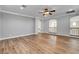 Bonus room with arched doorways, railing views to downstairs, and wood flooring at 3618 Auckland Castle St, Las Vegas, NV 89135