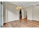 Elegant dining room featuring hardwood floors, chandelier, and an arched doorway at 3618 Auckland Castle St, Las Vegas, NV 89135