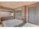 Inviting covered front porch with stone columns and a gray front door at 3618 Auckland Castle St, Las Vegas, NV 89135