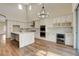 Modern kitchen featuring quartz countertops, stainless steel appliances, wine rack, and custom white cabinets at 3618 Auckland Castle St, Las Vegas, NV 89135