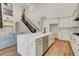 Open-concept kitchen boasts quartz island, stainless appliances, and seamless transition to living area at 3618 Auckland Castle St, Las Vegas, NV 89135