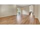 Bright and airy living room with hardwood floors, chandelier and sliding glass doors at 3618 Auckland Castle St, Las Vegas, NV 89135