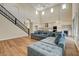 Open concept living room featuring high ceilings, wood floors, and a staircase at 3618 Auckland Castle St, Las Vegas, NV 89135