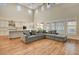 Bright living room featuring vaulted ceilings, an open floor plan, and sliding doors to the backyard at 3618 Auckland Castle St, Las Vegas, NV 89135
