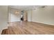 Spacious room with hardwood floors, recessed lighting, and an archway leading to the staircase at 3618 Auckland Castle St, Las Vegas, NV 89135