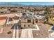 Aerial view of the home with a detached garage, solar panels, and a backyard pool at 3708 Calumet Farm Cir, North Las Vegas, NV 89031