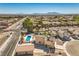 Overhead view of a single-Gathering home with a private backyard swimming pool and desert landscaping in a residential area at 3708 Calumet Farm Cir, North Las Vegas, NV 89031