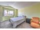Bright bedroom with ample natural light from a large window and neutral colored walls and carpet at 3708 Calumet Farm Cir, North Las Vegas, NV 89031