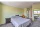Inviting bedroom with neutral walls and carpet, and access to an ensuite bathroom at 3708 Calumet Farm Cir, North Las Vegas, NV 89031