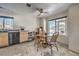 Cozy dining area featuring wood table with seating near kitchen and a bright window at 3708 Calumet Farm Cir, North Las Vegas, NV 89031