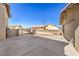 Wide concrete driveway between detached garage and side yard of home at 3708 Calumet Farm Cir, North Las Vegas, NV 89031