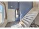 Welcoming entryway features stylish tile flooring, a bright white door, and staircase leading to the upper level at 3708 Calumet Farm Cir, North Las Vegas, NV 89031