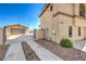 Two-story home has a driveway and is landscaped with decorative rock at 3708 Calumet Farm Cir, North Las Vegas, NV 89031
