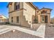 A charming residence exhibits manicured desert landscaping and a side-entry door, blending curb appeal with privacy at 3708 Calumet Farm Cir, North Las Vegas, NV 89031