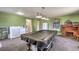 Spacious game room features pool table, laundry, water filtration, desk, and plenty of storage at 3708 Calumet Farm Cir, North Las Vegas, NV 89031