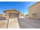 Spacious detached garage and large concrete driveway with access to the backyard pool area at 3708 Calumet Farm Cir, North Las Vegas, NV 89031