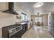 Well-equipped kitchen features a gas range, stainless steel appliances, and a view to the dining area at 3708 Calumet Farm Cir, North Las Vegas, NV 89031