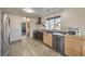 Functional kitchen with stainless steel appliances, dark countertops, and bright natural lighting at 3708 Calumet Farm Cir, North Las Vegas, NV 89031