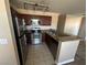 Kitchen featuring stainless steel appliances and granite countertops at 4050 Pacific Harbors Dr # 217, Las Vegas, NV 89121