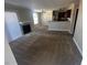 Inviting living room with fireplace, adjoining kitchen and lots of natural light at 4050 Pacific Harbors Dr # 217, Las Vegas, NV 89121