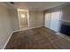 Cozy living room with plush carpeting, fireplace, and sliding glass doors for natural light at 4050 Pacific Harbors Dr # 217, Las Vegas, NV 89121