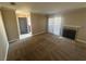 Inviting living room with adjacent front door and fireplace at 4050 Pacific Harbors Dr # 217, Las Vegas, NV 89121