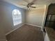Open living space with large window, neutral paint and plush carpeting at 4050 Pacific Harbors Dr # 217, Las Vegas, NV 89121