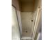 Shower features a glass door and white surround at 4050 Pacific Harbors Dr # 217, Las Vegas, NV 89121