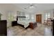 Bedroom featuring a large bed, several windows, a ceiling fan, and tiled flooring at 4128 Tarkin Ave, Las Vegas, NV 89120