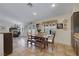 Charming dining area with wood table, bench seating, and view of the cozy living room at 4128 Tarkin Ave, Las Vegas, NV 89120