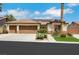 Charming single-story home featuring a three-car garage, desert landscaping, and a tile roof, perfect for curb appeal at 4128 Tarkin Ave, Las Vegas, NV 89120