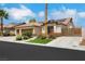Inviting home with desert landscaping, three-car garage, and tile roof, perfect for low-maintenance living at 4128 Tarkin Ave, Las Vegas, NV 89120