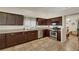 Well-equipped kitchen featuring dark wood cabinetry and stainless steel appliances at 4128 Tarkin Ave, Las Vegas, NV 89120
