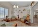 Bright living room with comfortable seating, turtle decorations, and abundant natural light at 4128 Tarkin Ave, Las Vegas, NV 89120