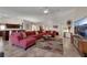 Spacious living room with open floor plan, tile floors, and plenty of natural light, ideal for Gathering gatherings at 4128 Tarkin Ave, Las Vegas, NV 89120