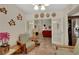 Inviting living room showcasing French doors, turtle art, and a glimpse into the adjacent space at 4128 Tarkin Ave, Las Vegas, NV 89120