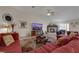Comfortable living room with vaulted ceilings, tile floors, and a fireplace, creating a perfect gathering space at 4128 Tarkin Ave, Las Vegas, NV 89120