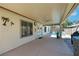 Covered patio with ceiling fan, leading to a refreshing backyard pool and outdoor seating area at 4128 Tarkin Ave, Las Vegas, NV 89120
