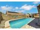 Backyard pool area featuring a sparkling pool with decorative tile and a relaxing lounge area at 4128 Tarkin Ave, Las Vegas, NV 89120