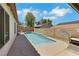 Sparkling pool featuring decorative dolphin wall art and a spacious deck ideal for relaxation and entertaining at 4128 Tarkin Ave, Las Vegas, NV 89120
