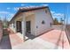 Backyard exterior showcases a terra cotta patio and modern stucco wall design at 4149 Compass Rose Way, Las Vegas, NV 89108