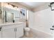 Modern bathroom features white cabinetry, quartz counters, and a shower-tub combination at 4149 Compass Rose Way, Las Vegas, NV 89108