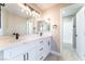 Bathroom featuring dual sinks, modern fixtures, and bright lighting at 4149 Compass Rose Way, Las Vegas, NV 89108