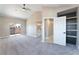 Spacious bedroom featuring vaulted ceiling and access to an en-suite bathroom at 4149 Compass Rose Way, Las Vegas, NV 89108