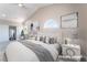 Staged bedroom featuring bright windows and carpeted floors at 4149 Compass Rose Way, Las Vegas, NV 89108